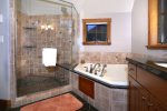 Master Bath has Fantastic Oversized Shower with River Rock Floors